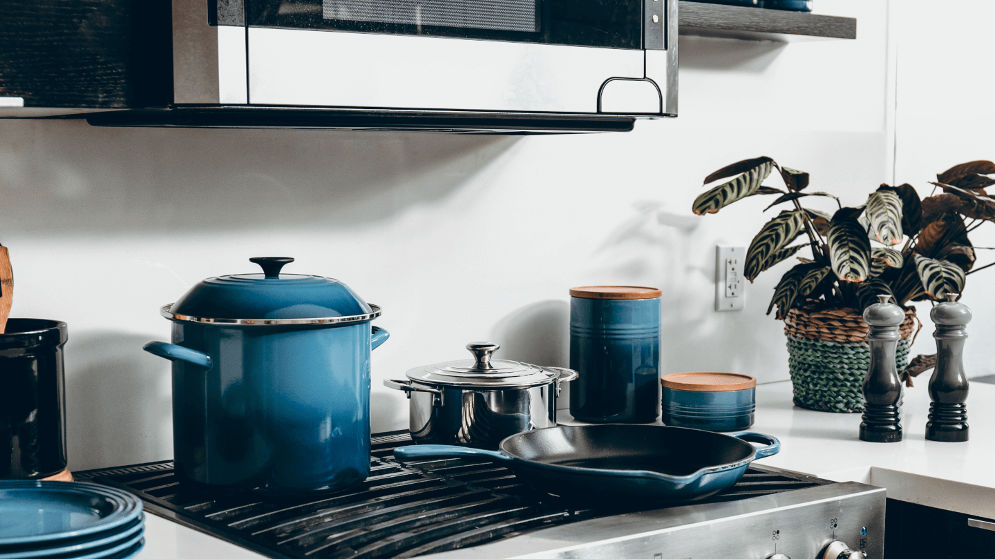 blue pots and pans on a hob