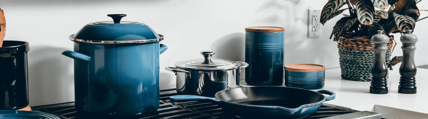 blue pots and pans on a hob